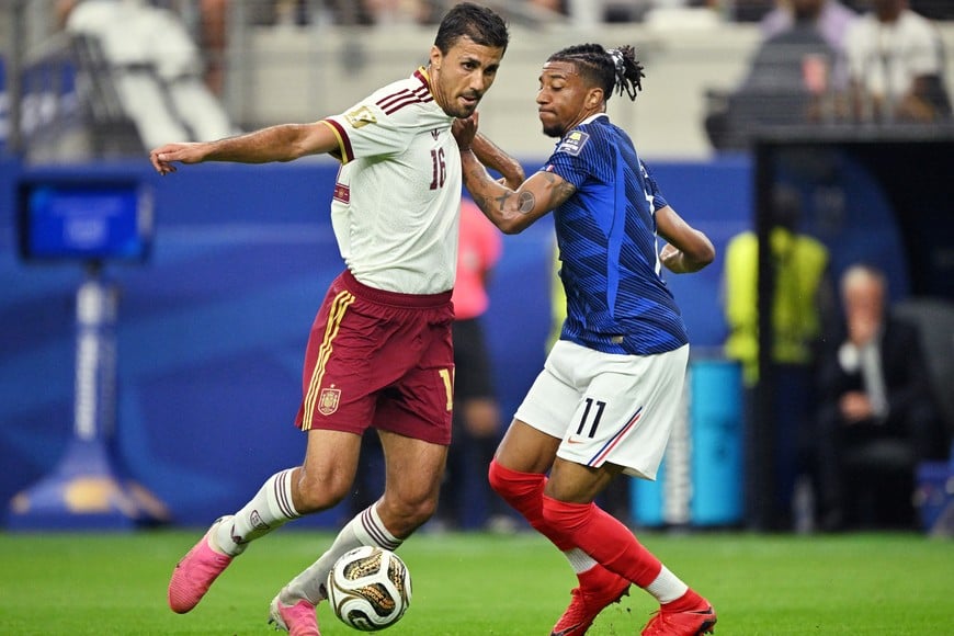 Soccer Football - FIFA World Cup 2026 - Semi Final - France v Spain - Dallas Stadium, Arlington, Texas, U.S. - July 14, 2026
Spain's Rodri in action with France's Michael Olise IMAGN IMAGES via Reuters/Jerome Miron