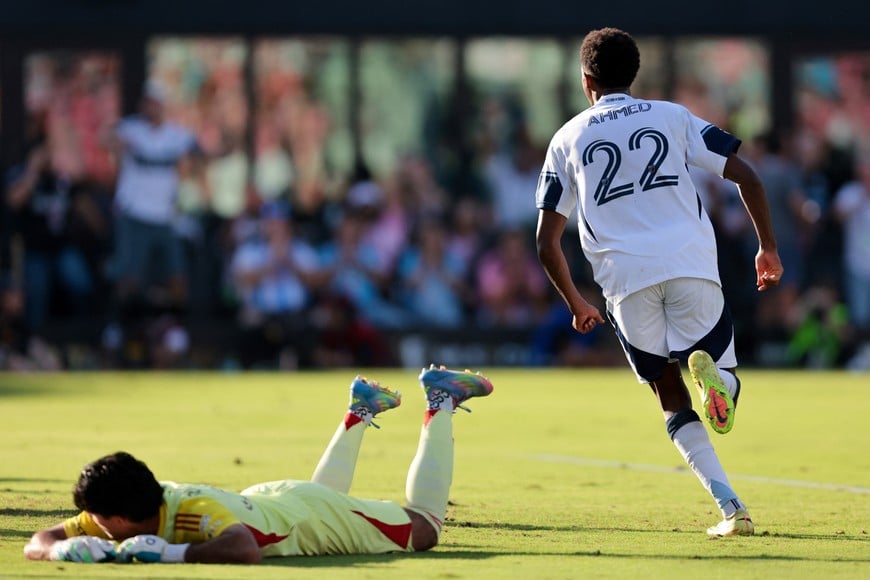 Dec 6, 2025; Fort Lauderdale, Florida, USA; Inter Miami goalkeeper Rocco Rios Novo (34) looks on as Vancouver Whitecaps FC midfielder Ali Ahmed (22) celebrates after scoring a goal in the second half during the 2025 MLS Cup at Chase Stadium. Mandatory Credit: Sam Navarro-Imagn Images