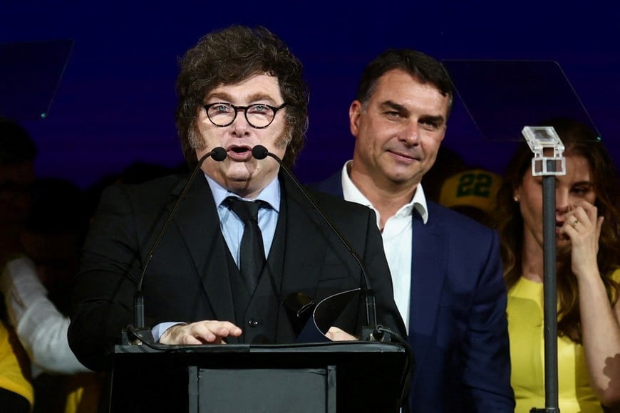 Argentine President Javier Milei speaks next to Brazilian Senator Flavio Bolsonaro, who is to be announced as candidate for Brazil's presidential elections, during the national convention of the Liberal Party (PL) in Sao Paulo, Brazil, July 25, 2026. REUTERS/Jean Carniel