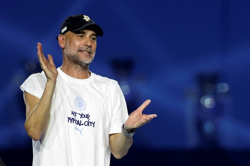 Soccer Football - Manchester City FA Cup and Carabao Cup Victory Parade - Manchester, Britain - May 25, 2026
Manchester City manager Pep Guardiola celebrates after the victory parade Action Images via Reuters/Jason Cairnduff