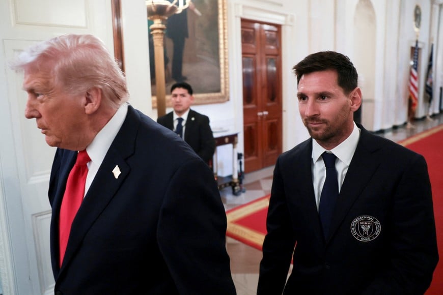 U.S. President Donald Trump arrives with Inter Miami CF captain Lionel Messi on the day he honors reigning Major League Soccer (MLS) champion Inter Miami CF players and team officials with an event in the East Room of the White House in Washington, D.C., U.S., March 5, 2026. REUTERS/Jonathan Ernst