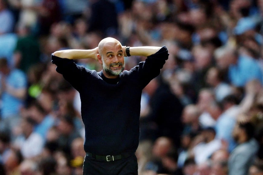 FILE PHOTO: Soccer Football - Premier League - Manchester City v Crystal Palace - Etihad Stadium, Manchester, Britain - April 12, 2025
Manchester City manager Pep Guardiola reacts towards fans after Omar Marmoush scored their second goal Action Images via Reuters/Lee Smith/File Photo EDITORIAL USE ONLY. NO USE WITH UNAUTHORIZED AUDIO, VIDEO, DATA, FIXTURE LISTS, CLUB/LEAGUE LOGOS OR 'LIVE' SERVICES. ONLINE IN-MATCH USE LIMITED TO 120 IMAGES, NO VIDEO EMULATION. NO USE IN BETTING, GAMES OR SINGLE CLUB/LEAGUE/PLAYER PUBLICATIONS. PLEASE CONTACT YOUR ACCOUNT REPRESENTATIVE FOR FURTHER DETAILS..