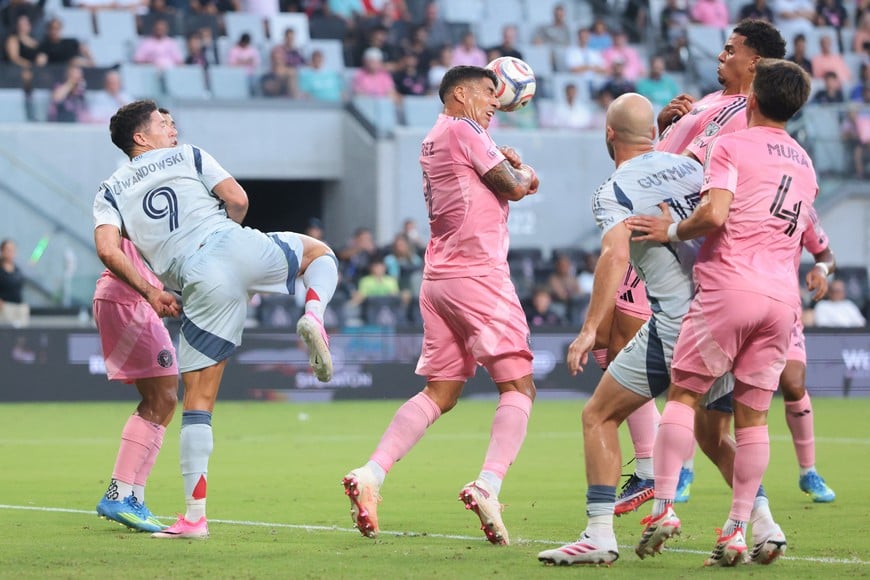 Jul 22, 2026; Miami, Florida, USA; Inter Miami CF forward Luis Suarez (9) clears the ball with a header against Chicago Fire FC forward Robert Lewandowski (9) during the first half at Nu Stadium. Mandatory Credit: Sam Navarro-Imagn Images