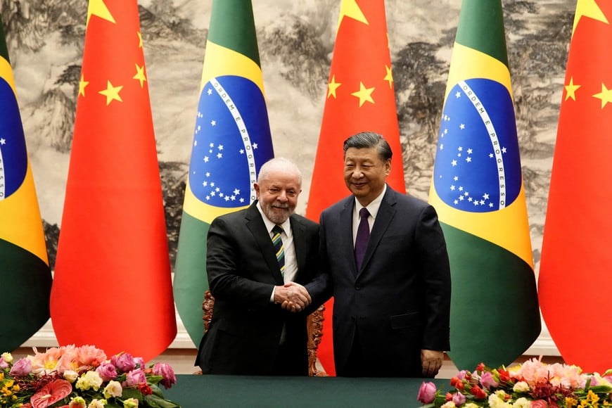 FILE PHOTO: Brazilian President Luiz Inacio Lula da Silva shakes hands with Chinese President Xi Jinping after a signing ceremony held at the Great Hall of the People in Beijing, China, April 14, 2023. Ken Ishii/Pool via REUTERS/File Photo
