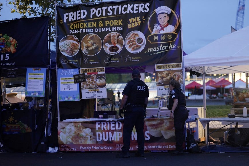 Police officers work after Seattle Police responded to what they described as a shooting with "multiple" victims at Seattle Center, which was hosting a Bite of Seattle food festival, in Seattle, Washington, U.S., July 26, 2026. REUTERS/Jason Redmond