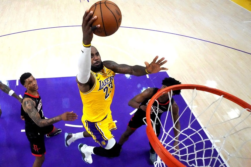 FILE PHOTO: Apr 18, 2026; Los Angeles, California, USA; Los Angeles Lakers forward LeBron James (23) shoots the ball against Houston Rockets forward Jabari Smith Jr. (10) and guard Amen Thompson (1) in the second half during game one of the first round of the 2026 NBA Playoffs at Crypto.com Arena. Mandatory Credit: Kirby Lee-Imagn Images/File Photo