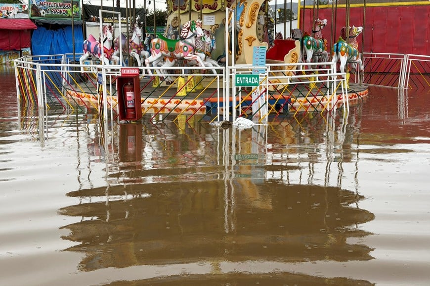 A carousel at an amusement park stands flooded after heavy rainfall from a weather front caused flooding and prompted Chilean authorities to declare a state of emergency, in La Serena, Chile, July 21, 2026. Picture taken with a mobile phone. REUTERS/Nicolas Cortes