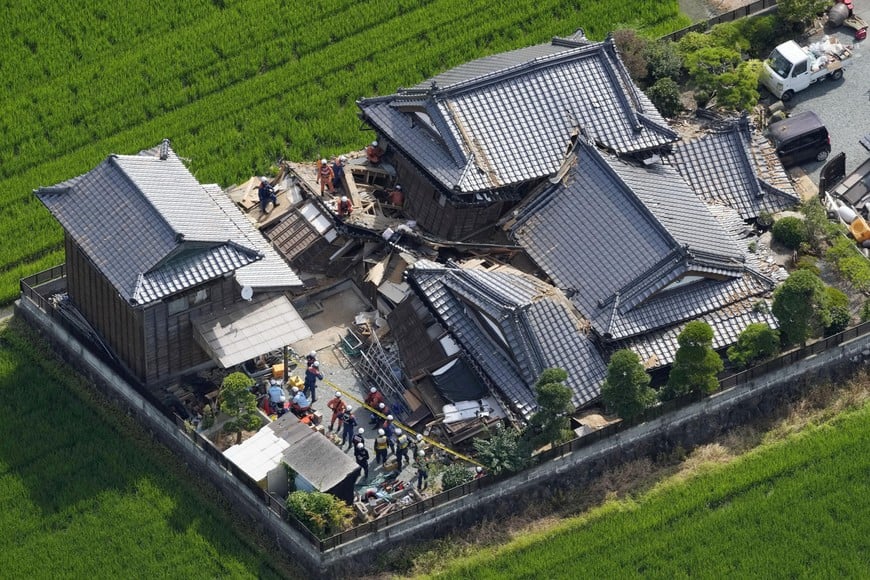 Emergency workers carry out search and rescue operations at a collapsed house after an earthquake with a magnitude of 7.1 struck Japan's southern Kumamoto prefecture, in Hikawa Town, Kumamoto Prefecture, Japan, July 29, 2026. Kyodo/via REUTERS ATTENTION EDITORS - THIS IMAGE HAS BEEN SUPPLIED BY A THIRD PARTY. MANDATORY CREDIT. JAPAN OUT. NO COMMERCIAL OR EDITORIAL SALES IN JAPAN. TPX IMAGES OF THE DAY