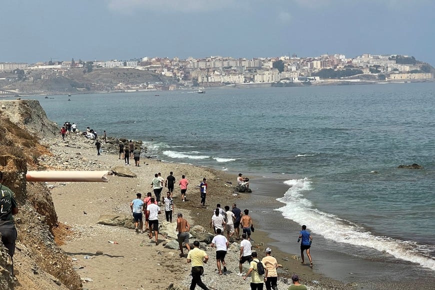 Migrants cross on foot into the North African enclave of Ceuta from Morocco by attemping to swim, according to Spain's Guardia Civil, near the border with Ceuta, in Fnideq, Morocco, July 30, 2026, in this still image obtained by REUTERS. THIS IMAGE HAS BEEN SUPPLIED BY A THIRD PARTY.
VERIFICATION:
- Buildings, coastline and road layout matched satellite and archive imagery.
- Coordinates: 35.85783579352456, -5.346942135788912.
- Date verified by original file metadata.