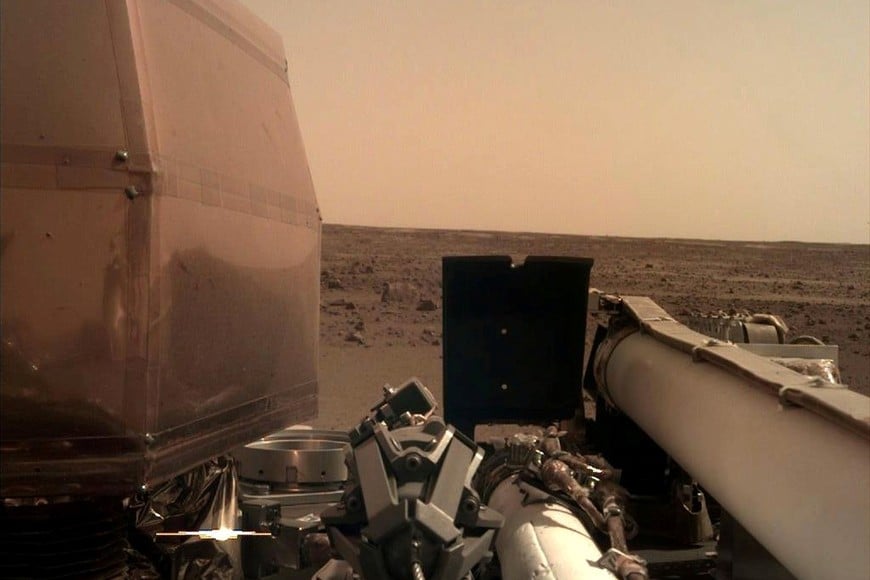 The Instrument Deployment Camera (IDC), located on the robotic arm of NASA's InSight lander, took this image of the Martian surface the day the spacecraft touched down on the Red Planet, and was relayed from InSight to Earth via NASA's Odyssey spacecraft, currently orbiting Mars, on November 26, 2018. Picture taken November 26, 2018. NASA/JPL-Caltech/Handout via REUTERS ATTENTION EDITORS - THIS IMAGE WAS PROVIDED BY A THIRD PARTY.?