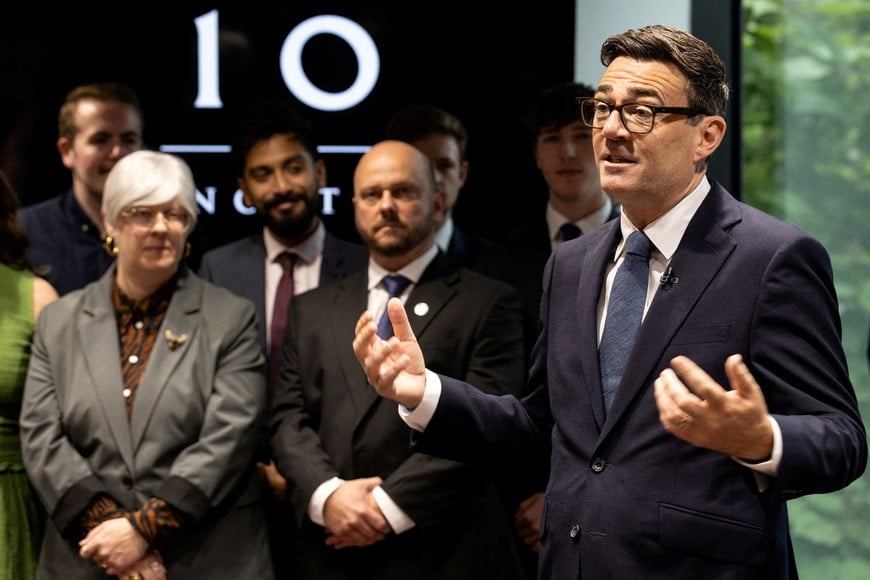 Britain's Prime Minister Andy Burnham welcomes staff as he officially opens No. 10 North at Heron House, in Manchester, Britain, July 24, 2026. James Speakman/Pool via REUTERS TPX IMAGES OF THE DAY