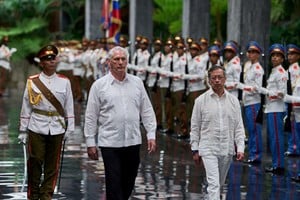 Cuba's President Miguel Diaz-Canel, center, and Colombia’s President Gustavo Petro, right, review troops during a welcoming ceremony at Revolution Palace, in Havana, Cuba, Friday, July 31, 2026. Ramon Espinosa/Pool via REUTERS