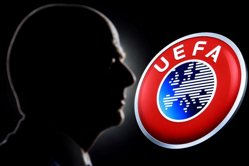 A silhouette depicting FIFA President Gianni Infantino is seen next to the UEFA logo in this illustration taken July 30, 2026. REUTERS/Dado Ruvic/Illustration