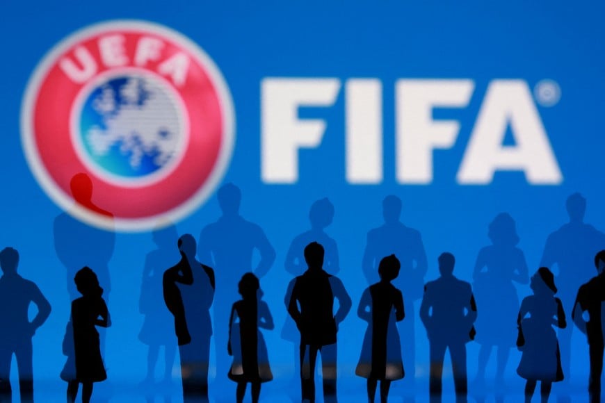 FIFA and UEFA logos and silhouettes of people are seen in this illustration taken July 30, 2026. REUTERS/Dado Ruvic/Illustration