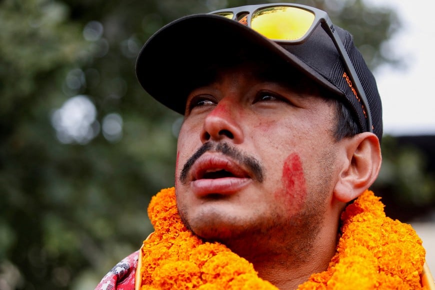 Nirmal Purja, who became the fastest person to summit the world's 14 highest mountains, speaks with the media upon his arrival at Tribhuvan International Airport in Kathmandu, Nepal, October 30, 2019. Picture taken October 30, 2019. REUTERS/Navesh Chitrakar
