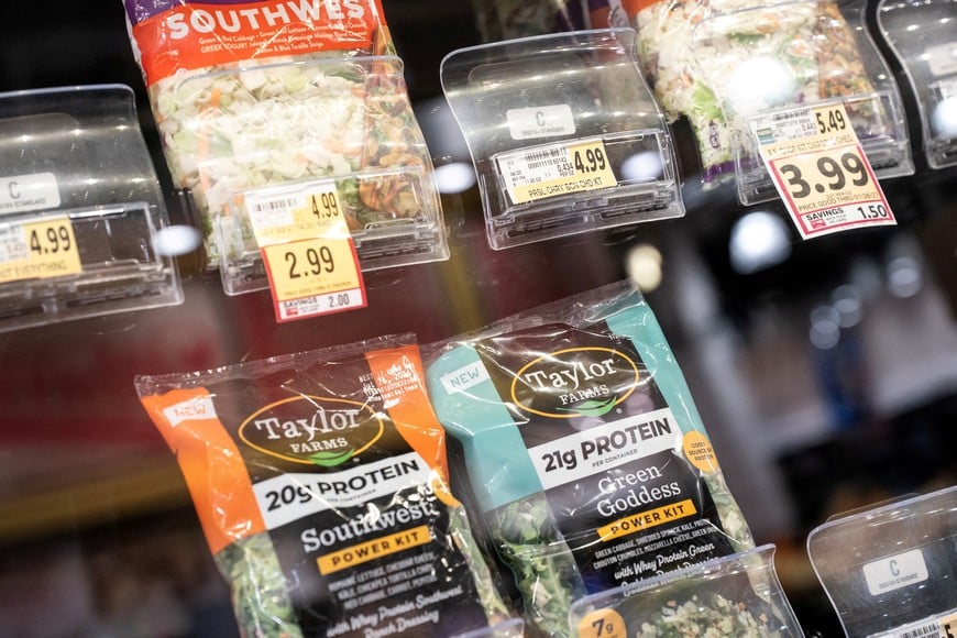 FILE PHOTO: Taylor Farms products are displayed for sale, amid reports of slumping consumer confidence in lettuce and other fresh produce during the current cyclosporiasis outbreak that has sickened thousands across the U.S., at a grocery store in Washington, D.C., U.S., July 24, 2026. REUTERS/Nathan Howard/File Photo