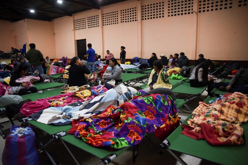 Evacuated residents rest in a shelter after increased activity at Guatemala's Fuego volcano, which prompted authorities to raise the alert level to orange, in San Juan Alotenango, Guatemala, August 4, 2026. REUTERS/Cristina Chiquin