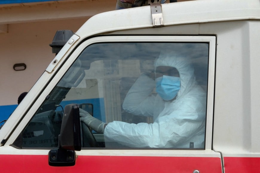 FILE PHOTO: A doctor wearing personal protective equipment (PPE) sits in an ambulance at the Ebola Virus Disease Treatment Center at the Bunia General Reference Hospital, one month after cases were confirmed in Bunia, eastern Democratic Republic of Congo, June 15, 2026. REUTERS/Gradel Muyisa Mumbere/File Photo