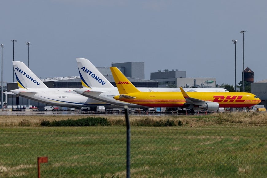 A DHL cargo plane and Ukrainian Antonov cargo planes at Leipzig/Halle Airport in Schkeuditz, Germany, August 5, 2026, after the police said explosives experts examined a drone found near a runway, and after a DHL cargo aircraft hit an unknown object as it was climbing away from the airport overnight, prompting an unscheduled landing in Hanover, according to a source familiar with the incident. REUTERS/Axel Schmidt     TPX IMAGES OF THE DAY