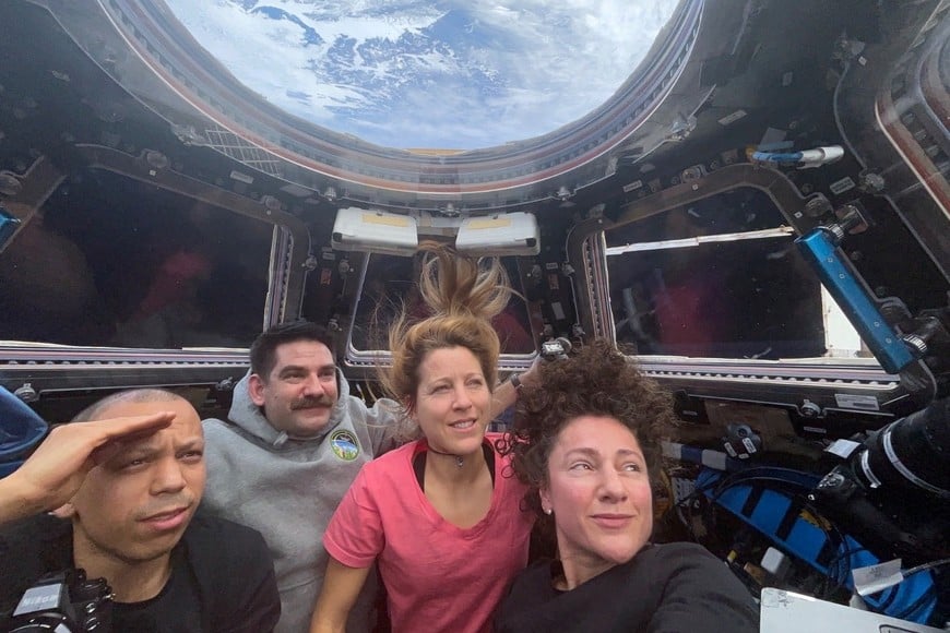 International Space Station crew members NASA astronauts Chris Williams, Jack Hathaway, and Jessica Meir and ESA astronaut Sophie Adenot, try to view the Artemis II crew's re-entry to Earth, from the cupola on the ISS, in this picture released April 10, 2026. Jessica Meir aboard via X/Handout via REUTERS    THIS IMAGE HAS BEEN SUPPLIED BY A THIRD PARTY. NO RESALES. NO ARCHIVES. MANDATORY CREDIT.