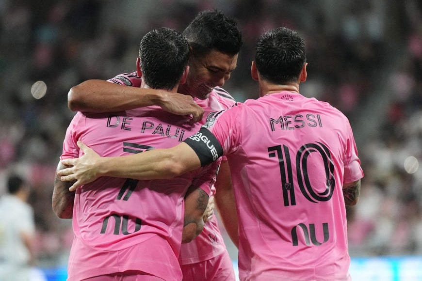 Aug 5, 2026; Miami, FL, USA; Inter Miami’s Carlos Henrique Casiniro, center, hugs forward Lionel Messi (10) and Rodrigo de Paul (7) after Messi’s second goal against Atlético San Luis during the first half of a Leagues Cup Phase One match at Nu Stadium. Mandatory Credit: Jim Rassol-Imagn Images