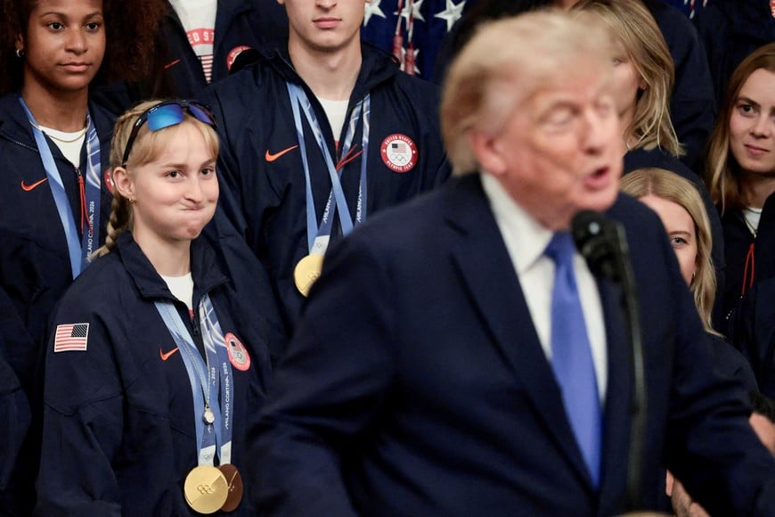 Olympic freestyle skier and gold and bronze medallist Elizabeth Lemley reacts while U.S. President Donald Trump speaks during a Team USA reception hosting athletes who competed for Team USA at the 2026 Winter Olympic and Paralympic Games in Milano Cortina, Italy, in the East Room at the White House in Washington, D.C., U.S., August 6, 2026. REUTERS/Evelyn Hockstein TPX IMAGES OF THE DAY