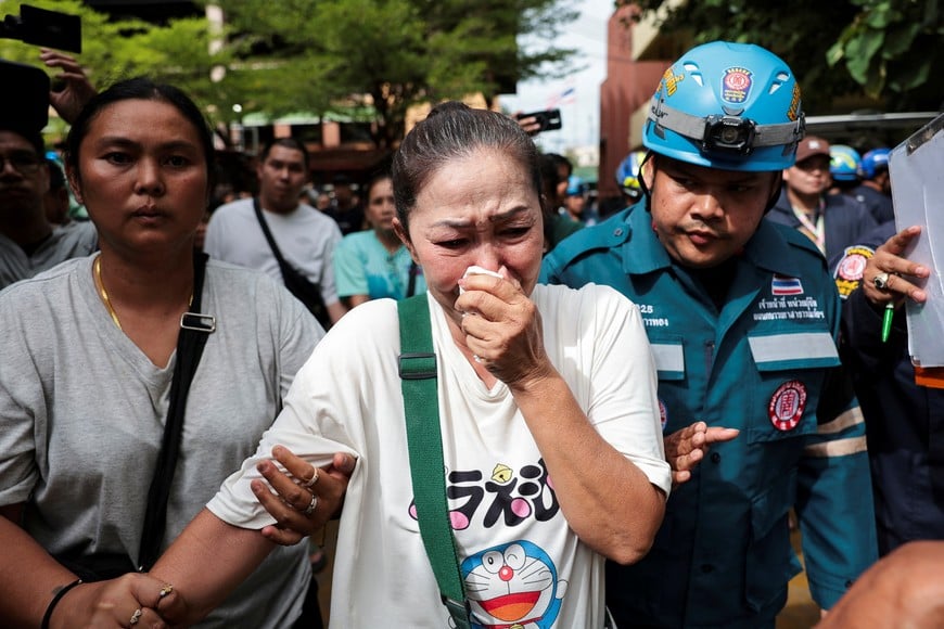 A relative of a victim reacts at Debsirin Nonthaburi School following the shooting incident that took place at the school, in Bang Kruai district, Nonthaburi province on the outskirts of Bangkok, Thailand, August 7, 2026. REUTERS/Chalinee Thirasupa