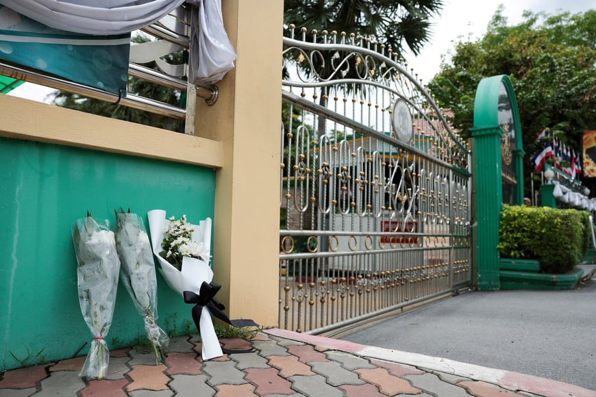 Flowers are left outside Debsirin Nonthaburi School, a day after the shooting incident at the school, in Bang Kruai district in Nonthaburi province, on the outskirts of Bangkok, Thailand, August 8, 2026. REUTERS/Chalinee Thirasupa