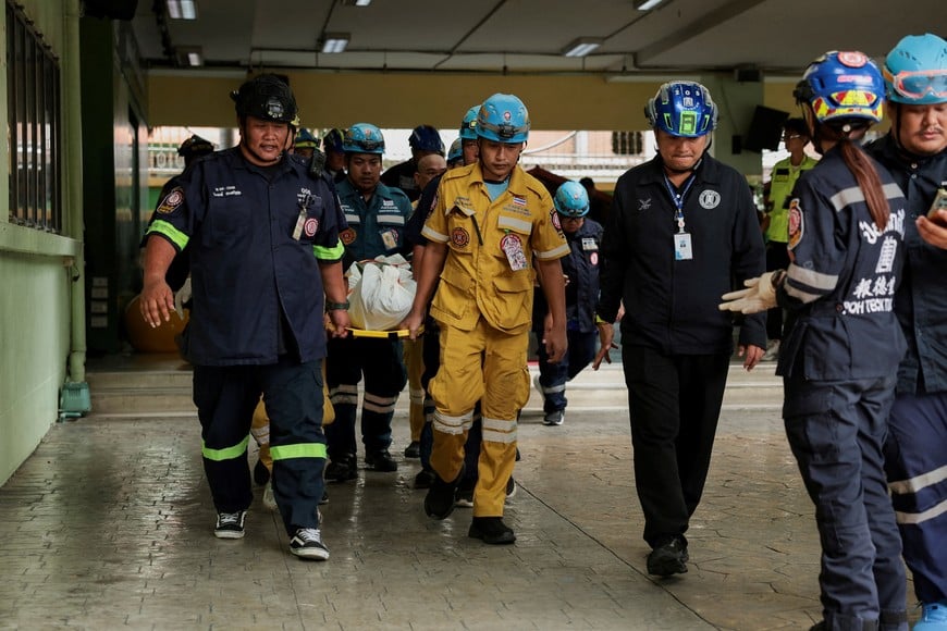 Emergency personnel carry a dead body on a stretcher at Debsirin Nonthaburi School following the shooting incident at the school, in Bang Kruai district in Nonthaburi province on the outskirts of Bangkok, Thailand, August 7, 2026. REUTERS/Chalinee Thirasupa TPX IMAGES OF THE DAY