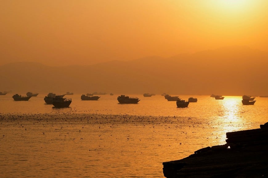 FILE PHOTO: Vessels at the Strait of Hormuz, as seen from Musandam, Oman, June 16, 2026. REUTERS/Stringer/File Photo