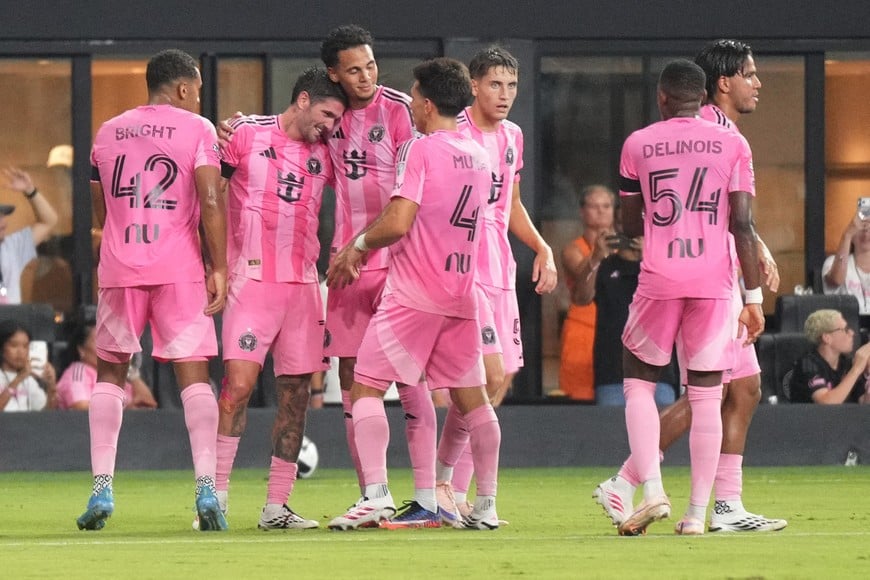 Aug 8, 2026; Miami, FL, USA; Inter Miami CF midfielder Rodrigo de Paul, second from left, reveals a Messi jersey under his own after scoring a goal against Monterrey in the first half of the Leagues Cup Phase One match at Nu Stadium. Lionel Messi was not at the game due to the passing of his father. Mandatory Credit: Jim Rassol-Imagn Images