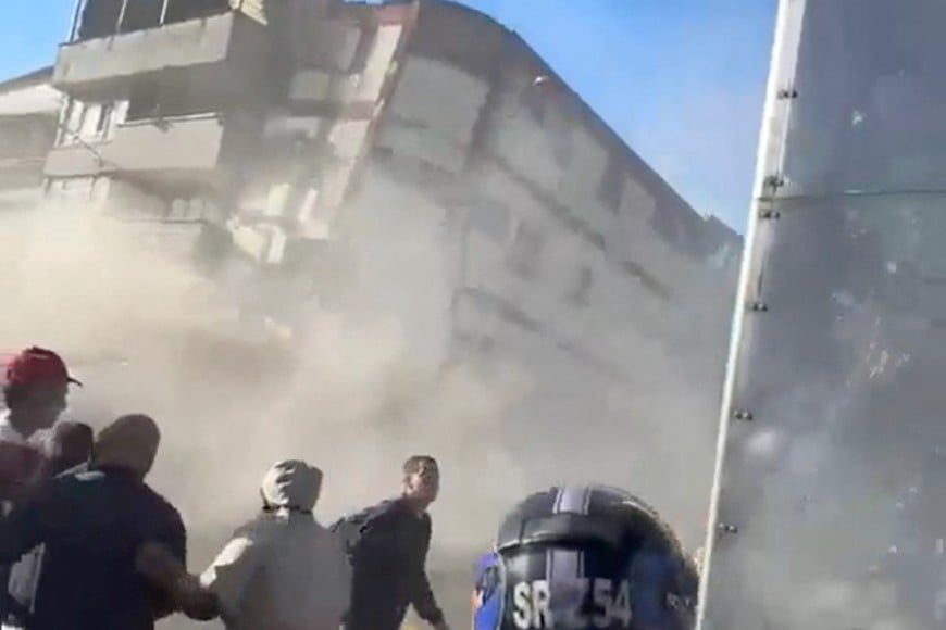 People watch as a building collapses during an earthquake in Pereira, Colombia August 10, 2026 in this screen grab obtained from a social media video. Social Media/via REUTERS  THIS IMAGE HAS BEEN SUPPLIED BY A THIRD PARTY. NO RESALES. NO ARCHIVES. NEWS USE ONLY.

VERIFICATION: 
Buildings, road layout, street signage, trees and businesses logos that matched archive and satellite imagery.
Coordinates: 4.813325123144079, -75.68931049269551.
Date verified by data from the U.S. Geological Survey (USGS) showing that a 7.4 magnitude earthquake struck western Columbia on August 10.
Risaralda department governor informed of a strong earthquake.