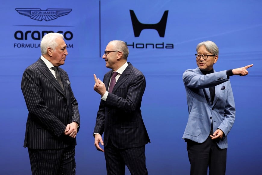 Aston Martin Aramco Formula One Team Executive Chairman Lawrence Stroll, Formula One Group President and F1 CEO Stefano Domenicali and Honda CEO Toshihiro Mibe prepare for a photo session during their joint press conference on their partnership launch announcement in Tokyo, Japan, January 20, 2026. REUTERS/Issei Kato