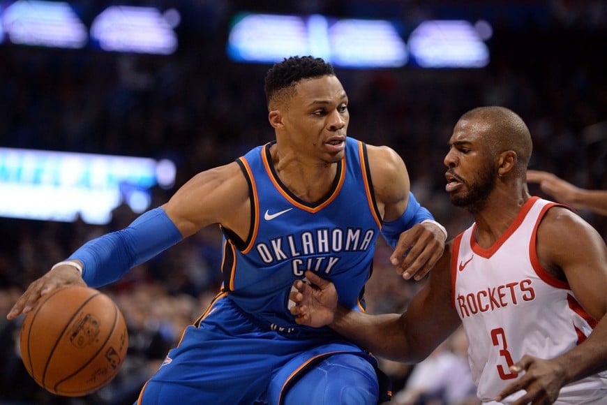 Mar 6, 2018; Oklahoma City, OK, USA; Oklahoma City Thunder guard Russell Westbrook (0) drives to the basket in front of Houston Rockets guard Chris Paul (3) during the fourth quarter at Chesapeake Energy Arena. Mandatory Credit: Mark D. Smith-USA TODAY Sports
