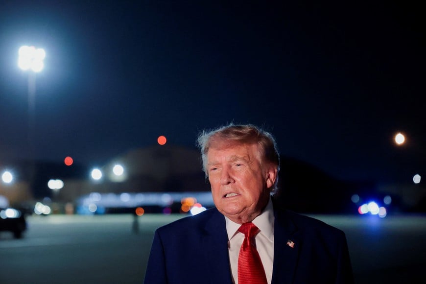 U.S. President Donald Trump speaks to members of the media after disembarking Air Force One at Joint Base Andrews, Maryland, U.S., August 11, 2026. REUTERS/Kylie Cooper