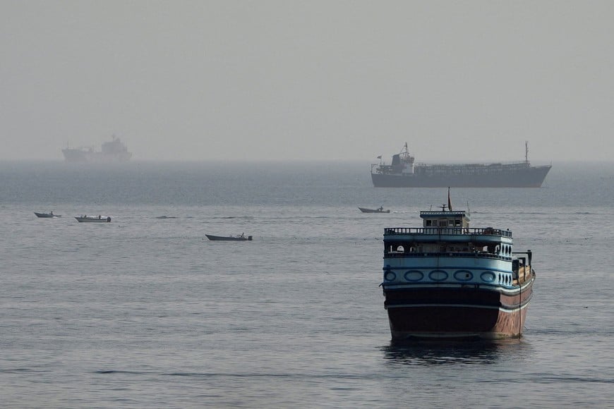 FILE PHOTO: Vessels in the Strait of Hormuz, as seen from Musandam, Oman, August 3, 2026. REUTERS/Stringer/File Photo