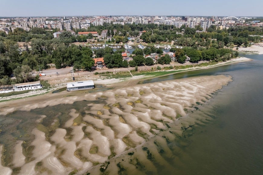 Newly exposed sandbank on the Danube River, as water levels drop amid prolonged hot weather and dry conditions, in Novi Sad, Serbia, August 12, 2026. REUTERS/Marko Djurica