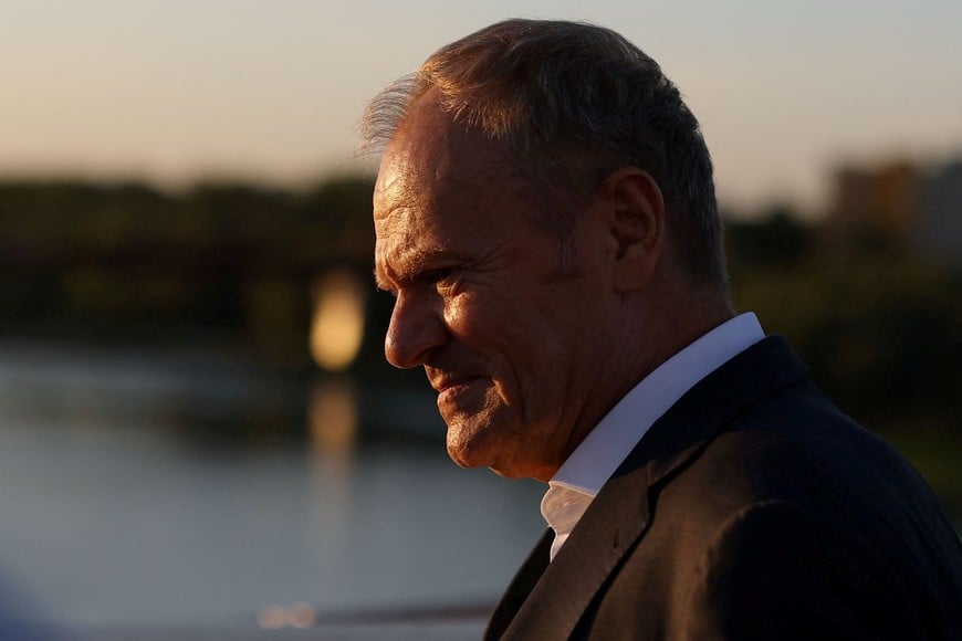Polish Prime Minister Donald Tusk looks on during a partial solar eclipse at the Copernicus Science Centre in Warsaw, Poland, August 12, 2026. REUTERS/Kacper Pempel