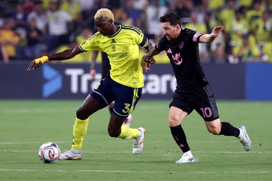 Aug 15, 2026; Nashville, Tennessee, USA; Nashville SC defender Maxwell Woledzi (3) breaks up an attack by Inter Miami CF forward Lionel Messi (10) during the first half at Geodis Park. Mandatory Credit: Alan Poizner-Imagn Images