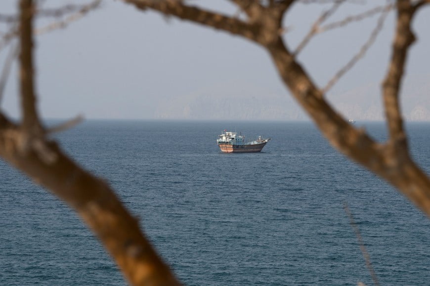 A vessel near the Strait of Hormuz, as seen from Musandam, Oman, August 17, 2026. REUTERS/Stringer