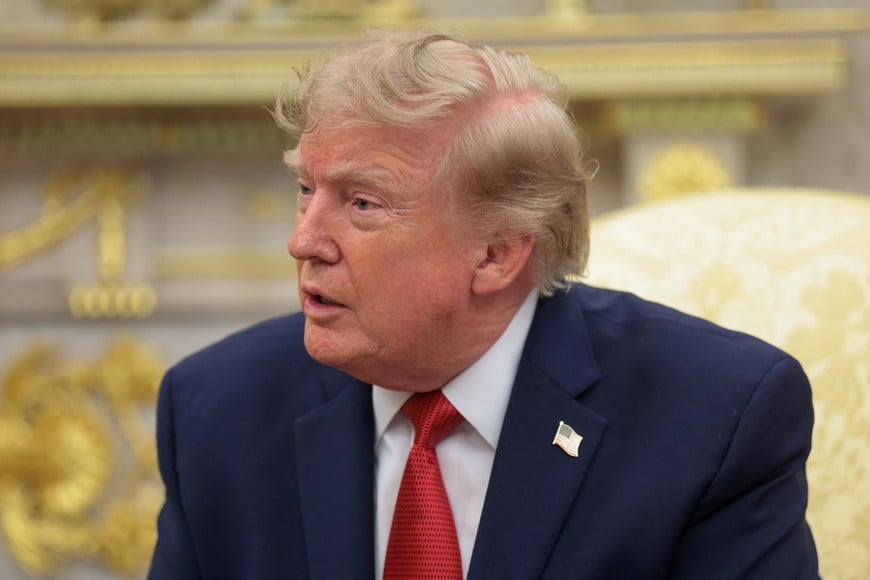 U.S. President Donald Trump speaks as he hosts 16-year-old lifeguard Ryder Williams, who saved a child off the coast of Santa Cruz, California, last month, Nathaniel Rai, the child saved by Williams, and Nathaniel's family members in the Oval Office at the White House in Washington, D.C., U.S., August 17, 2026. REUTERS/Kylie Cooper