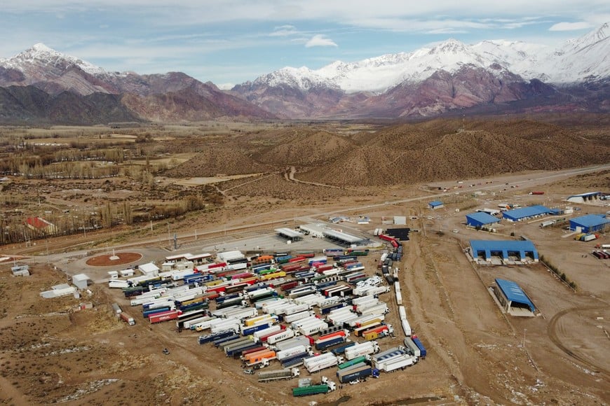 A drone view shows parked trucks as truckers wait for the Cristo Redentor border crossing between Argentina and Chile to reopen after heavy snowfall forced its closure, in Uspallata, Mendoza province, Argentina, July 22, 2026. REUTERS/Maximiliano Rios