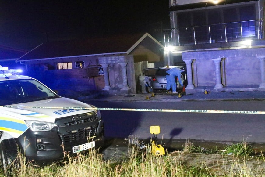 A forensic pathology vehicle is parked outside the home of former two-weight world boxing champion Zolani Tete following a fatal shooting in Mdantsane, Eastern Cape, South Africa, August 21, 2026. REUTERS/Stringer