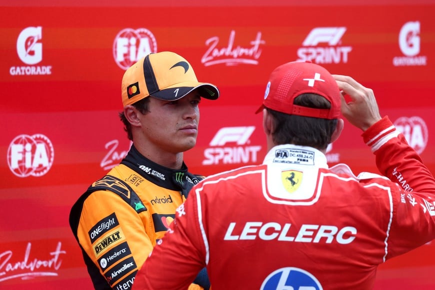 Formula One F1 - Dutch Grand Prix - Circuit Zandvoort, Zandvoort, Netherlands - August 22, 2026
Second place Ferrari's Charles Leclerc and third place McLaren's Lando Norris react after the sprint race REUTERS/Jakub Porzycki