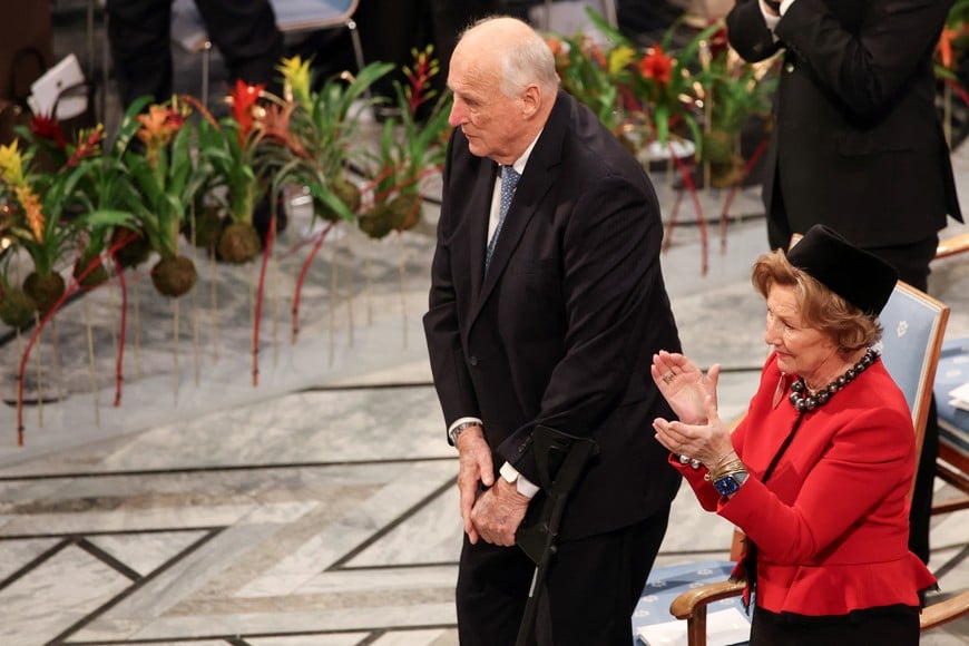 Norway's King Harald and Queen Sonja react at the end of the speech of Ana Corina Sosa Machado, daughter of Venezuelan opposition leader Maria Corina Machado, who received the Nobel Peace Prize on behalf of her mother, in Oslo, Norway December 10, 2025. REUTERS/Leonhard Foeger