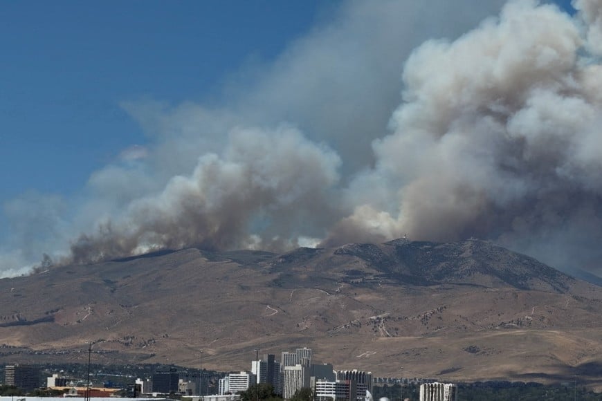 Smoke rises from hills during the Hawk Fire burning in Washoe County, Nevada, U.S., August 22, 2026 in this screengrab taken from a social media video. Kate Rouch/via REUTERS THIS IMAGE HAS BEEN SUPPLIED BY A THIRD PARTY. MANDATORY CREDIT. NO RESALES. NO ARCHIVES.
VERIFICATION:
-Location and date verified from original file metadata.
- Buildings, airport airfield, mountain in the background and a waterbody match satellite imagery