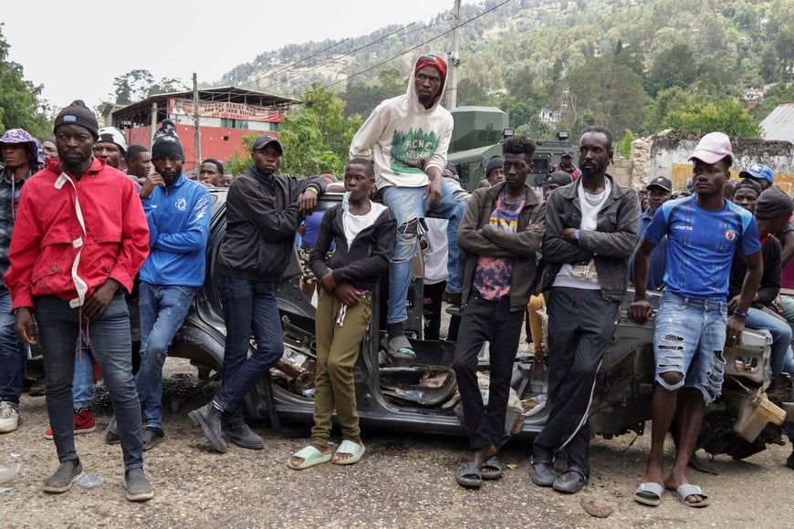 Residents gather during a protest against insecurity after a fatal overnight raid by an armed gang, on the outskirts of Port-au-Prince, in Kenscoff, Haiti, August 24, 2026. REUTERS/Fildor Pq Egeder