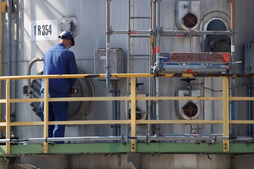 A man works at the PCK refinery, a crude oil processing facility supplying gasoline, jet fuel, diesel and fuel oil, in Schwedt/Oder, Germany, August 26, 2026. REUTERS/Axel Schmidt