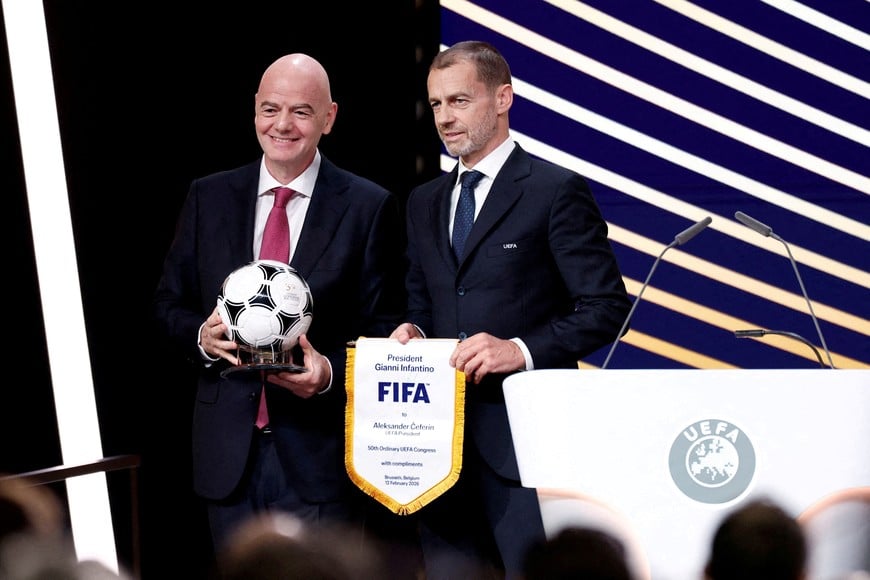 FILE PHOTO: Soccer Football - 50th Ordinary UEFA Congress - Brussels Expo, Brussels, Belgium - February 12, 2026
UEFA president Aleksander Ceferin and FIFA president Gianni Infantino pose for a photograph during the event REUTERS/Benoit Tessier/File Photo