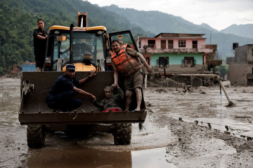 A survivor is transported to a safer place in a JCB following a flash flood at Trishuli in Nuwakot district, Nepal, August 26, 2026. REUTERS/Navesh Chitrakar     TPX IMAGES OF THE DAY